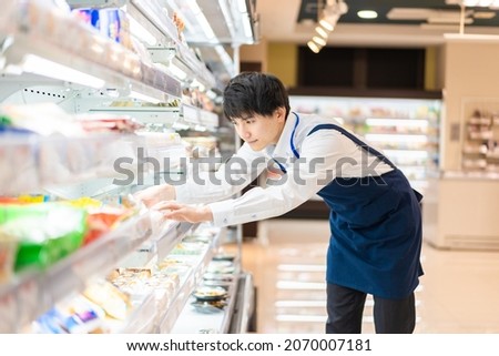 Young business person shopping at the supermarket