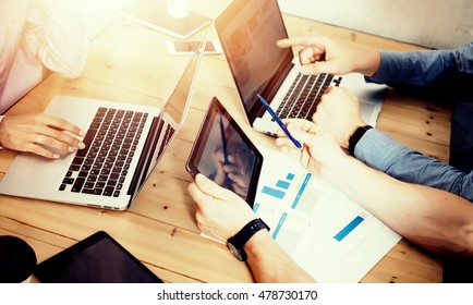 Young Business Team Brainstorming Meeting Room Process.Coworkers Startup Marketing Online Project.Creative People Making Great Work Decisions Wood Table.Tablet Laptop Diagram Screen.Blurred Background