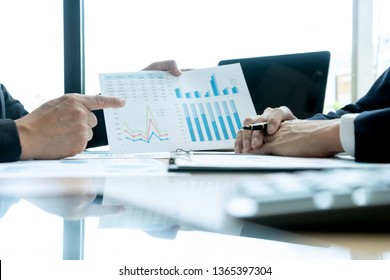 young business team in a small meeting in the office talk about  analyses chart graphy marketing plan with computer laptop. - Shutterstock ID 1365397304