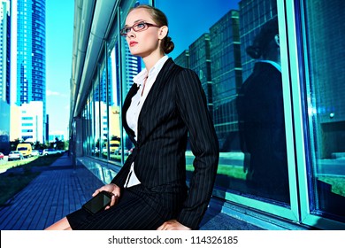 Young Business Woman In The Big City Purposefully Looking Away.