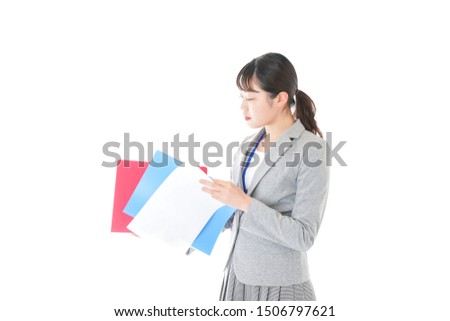 Young business woman checking documents in the office
