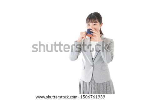 Young business woman drinking coffee