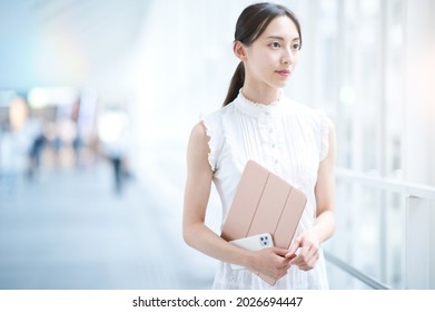 Young Business Woman Or Female College Student By The Window