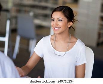Young business woman having conversation with her collegue - Shutterstock ID 249718234