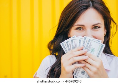 Young Business Woman Holding Money