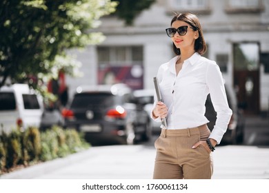 Young Business Woman With Laptop Outside The Street