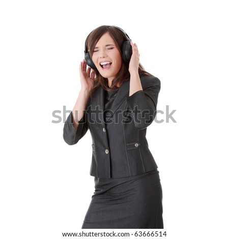 Young business woman listening music by headphone, isolated on white.