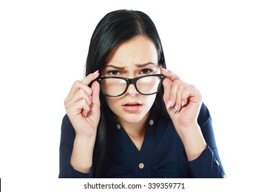 Young Business Woman Looking Over Glasses Worry About Somthing Or Trying To See