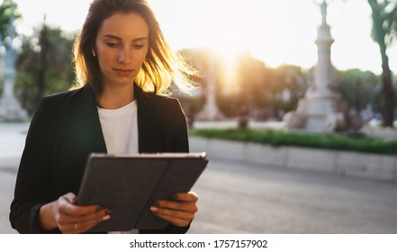 Young Business Woman Looking Screen On Tablet Working In Park Barcelona Sun Day, Professional Finance Girl Using Touch Pad On Background Sun Flare Outdoors