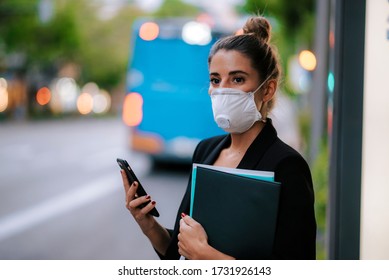 Young Business Woman With Medical Mask Waiting For The Bus