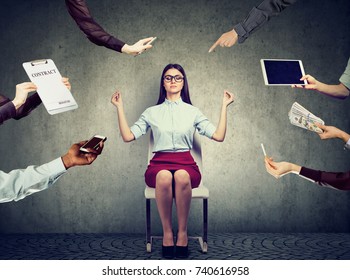 Young Business Woman Is Meditating To Relieve Stress Of Busy Corporate Life 