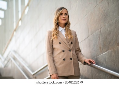 Young Business Woman On Subway Stairs