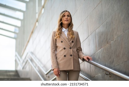 Young Business Woman On Subway Stairs