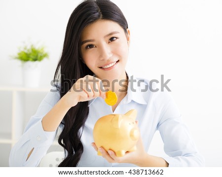 young business woman with  piggy bank