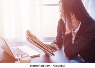 Young Business Woman Reading Newspaper In A Modern Office, Follow The News And Create Inspiration.