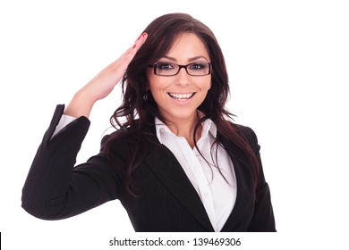 Young Business Woman Saluting You In A Military Style. On White Background