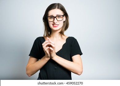 Young Business Woman Says Oops, Studio Photo Isolated On A Gray Background