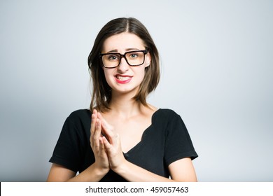 Young Business Woman Says Oops, Studio Photo Isolated On A Gray Background