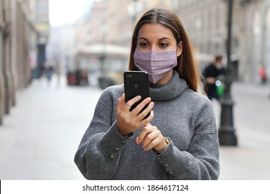 Young Business Woman Sending Message On Mobile Phone In City Street Wearing Face Mask Protection