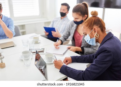 Young business woman takes notes in a workshop or seminar - Shutterstock ID 1926821045