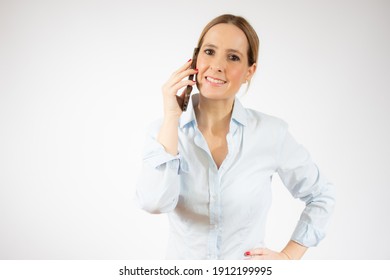 Young Business Woman Talking On Smart Phone Over White Background.