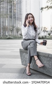 Young Business Woman Talking On The Phone Outdoors