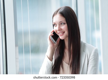young business woman talking on mobile phone - Shutterstock ID 723350398