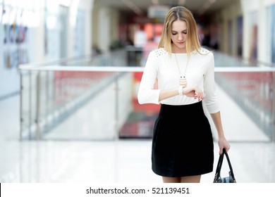 Young Business Woman In Trendy Casual Wear Hurrying, Waiting Impatient, Looking At Her Watch In A Rush, Running Errands, Copy Space