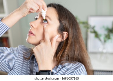 Young Business Woman Uses Eye Drops For Eye Treatment. Redness, Dry Eyes, Allergy And Eye Itching