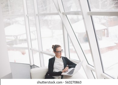 Young Business Woman Using Laptop In Office.