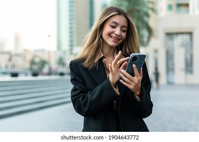 Young Business Woman Using Mobile Phone Outdoors