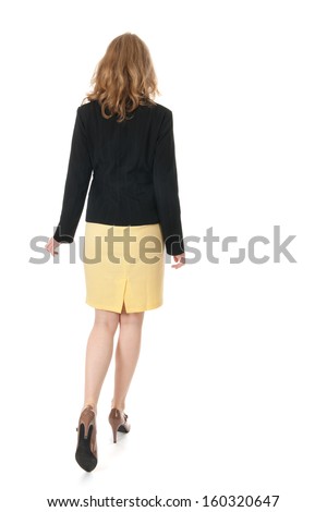 Young business woman is walking away