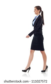 Young Business Woman  Walking. She Is Smiling And Looking Away From The Camera Isolated Over White Background