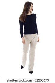 A Young Business Woman Is Walking. She Is Smiling And Looking Away From The Camera Isolated Over White Background