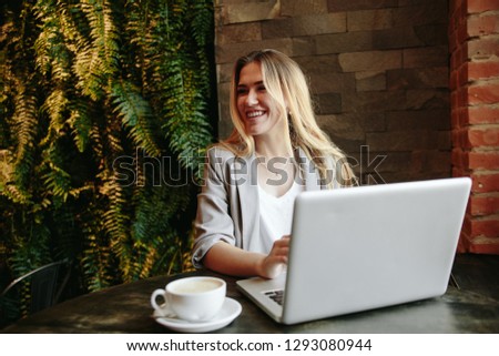 Young business woman working in cafe