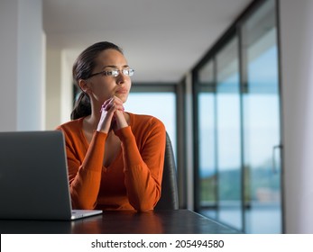 Young Business  Woman Working On Laptop Computer At Modern Home Office