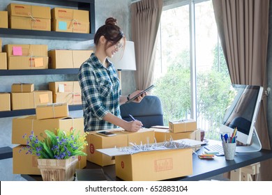 Young Business Woman Working Online Shopping At Her Home