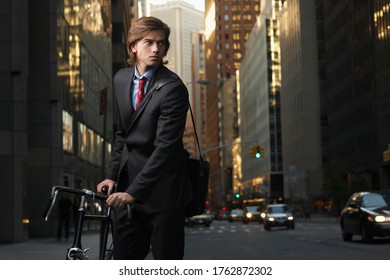 Young Businessman Bicycling To Work