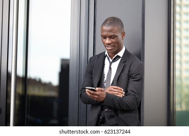 Young businessman calls on mobile in downtown - Shutterstock ID 623137244