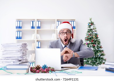 Young Businessman Celebrating Christmas In The Office