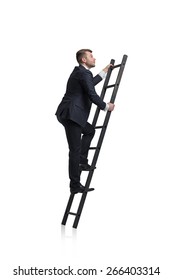 Young Businessman Is Climbing To The Career Ladder. Isolated.