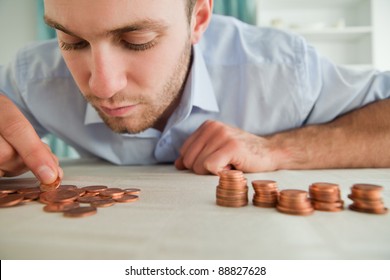 Young Businessman Counting Coins