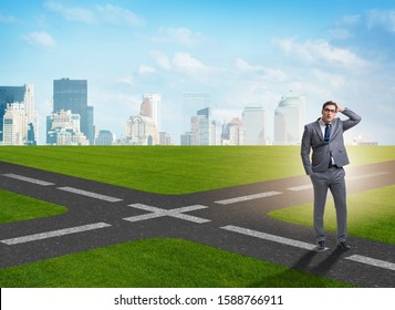 Young Businessman Crossroads Uncertainty Concept Stock Photo 1588766911 ...