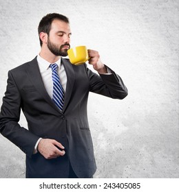 Young Businessman Drinking Coffee Over Textured Stock Photo 243405085 ...