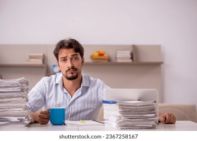 Young businessman employee working from home during pandemic - Powered by Shutterstock