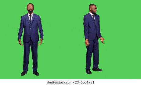 Young businessman expressing i dont know sign in studio and posing over full body green screen. Male company manager wearing office suit feeling confused, being uncertain or unsure on camera. - Powered by Shutterstock