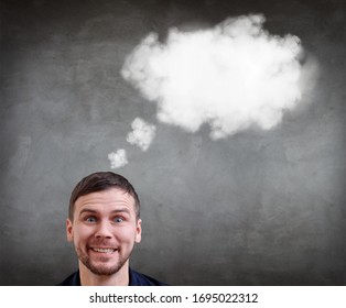 Young businessman feels triumph with white cloud for minds. Over gray wall background. - Shutterstock ID 1695022312