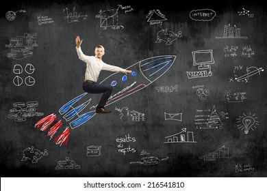 Young Businessman Flying In Sky On Drawn Rocket