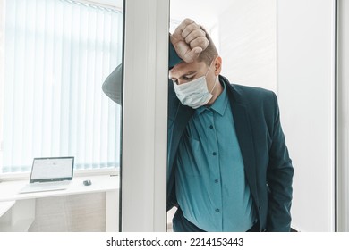 Young Businessman Has Fever And Feel Uncomfortable In The Office. An Employee In The Office Got Sick With Covid 19 Coronavirus. The Sick Employee Was Tired At Work.