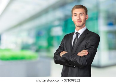 Young Businessman with his arms crossed - Shutterstock ID 371099252